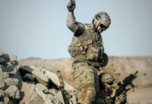 Photo by Pixabay: https://www.pexels.com/photo/2-soldier-with-guns-on-grey-pile-of-rocks-holding-smoke-stick-during-daytime-163489/